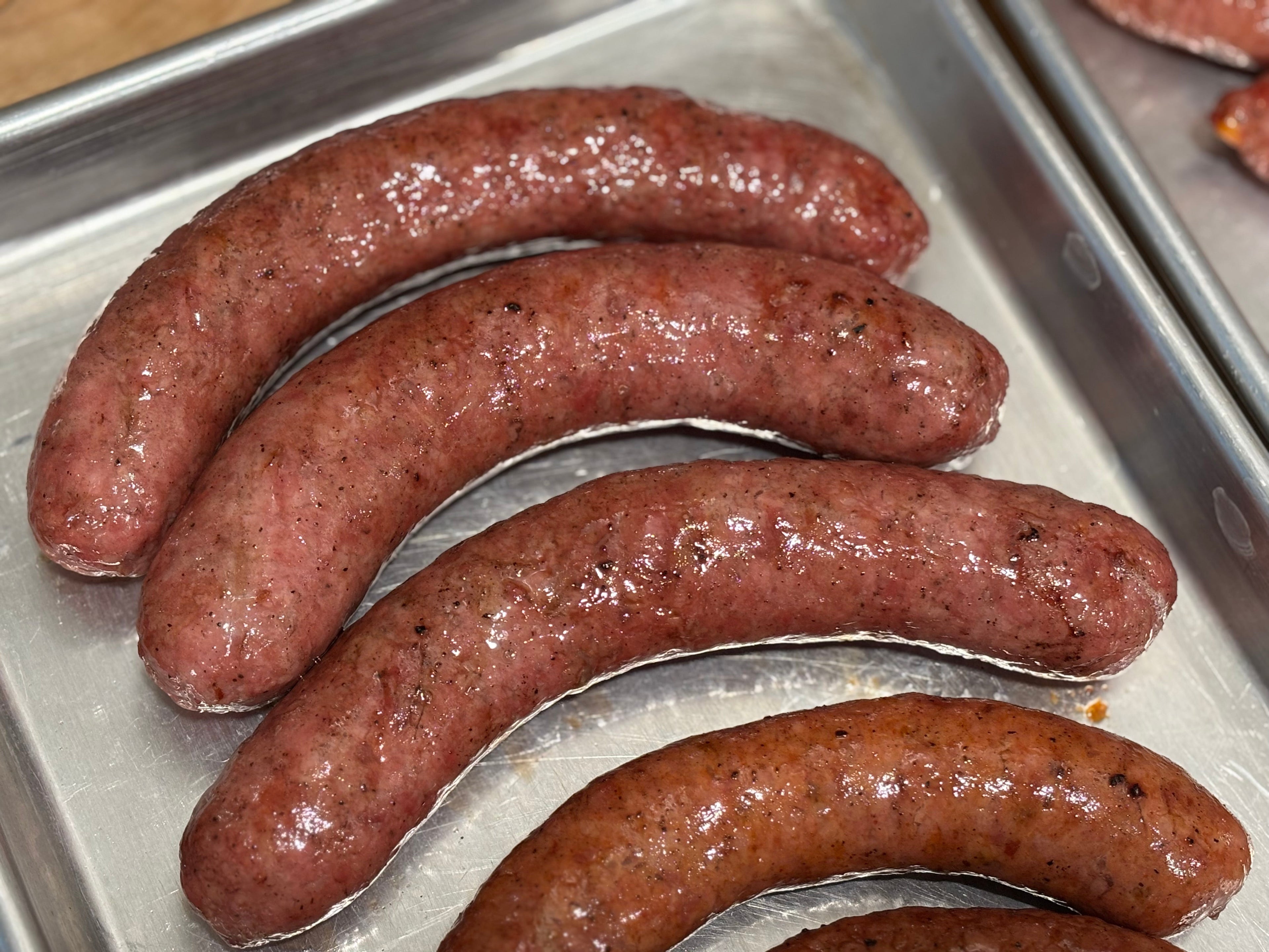 A tray of 4 smoked brats